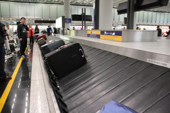 Luggage rotating on a baggage claim system in an airport.