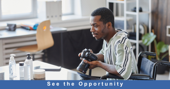 Photo of a male photographer with black skin considering an arrangement for a still photograph of personal care supplies