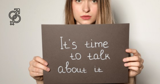 Photo of a woman holding a sign that says 'It's time to talk about it" the symbols for male/female are in the corner of the neutral background. 